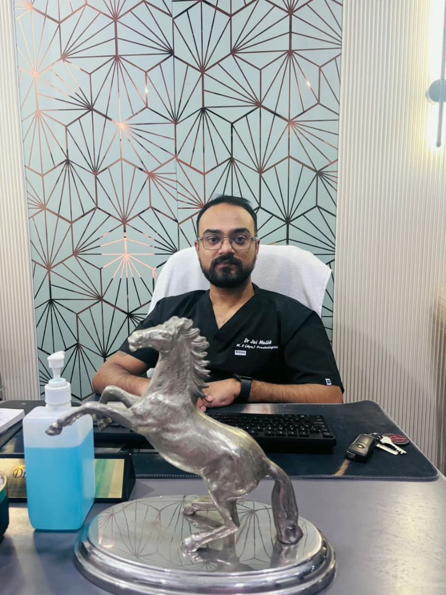Dr Jai Malik, proctologist, at his desk