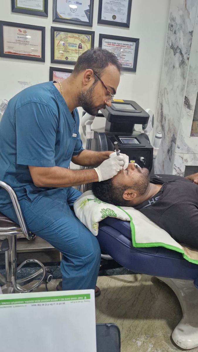 Dr Jai Malik performing a procedure near a patient's eye
